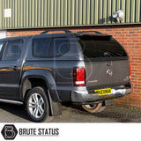 Volkswagen Amarok 2010-2022 Truckman GLS Hardtop Canopy with lockable sliding windows and remote locking, seen from rear three-quarter view. Brute Status logo visible.