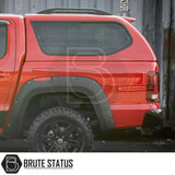 Volkswagen Amarok 2010-2022 Truckman GLS Hardtop Canopy with lockable sliding windows, black fender flares, and off-road wheels, enhancing pickup functionality and style.