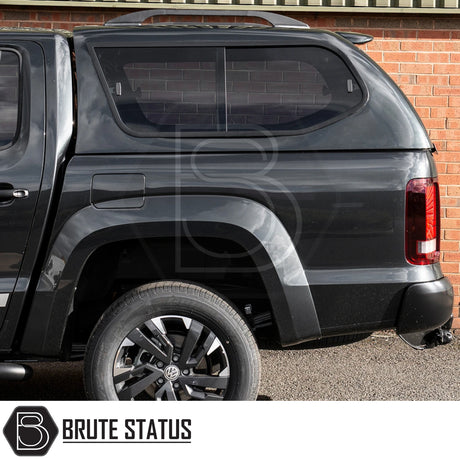 Volkswagen Amarok 2010-2022 with Truckman GLS Hardtop Canopy, featuring tinted sliding windows, Brute Status logo, and VW wheel, showcasing secure, stylish aftermarket accessory.