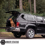 Volkswagen Amarok 2010-2022 Truckman GLS Hardtop Canopy with open rear, two dogs in truck bed, showcasing secure, ventilated canopy for pet-friendly travel.
