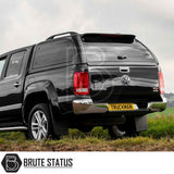 Volkswagen Amarok 2010-2022 Truckman Grand Hardtop Canopy with remote locking, featuring tinted windows and pop-out side panels, viewed from rear ¾ angle.