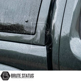 Close-up of Volkswagen Amarok 2010-2022 Truckman Grand Hardtop Canopy with Brute Status logo, showcasing raindrop-covered edge meeting the truck’s bed and cab.