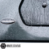 Close-up of rain-spattered Volkswagen Amarok Truckman Grand Hardtop Canopy, featuring TRUCKMAN badge and BRUTE STATUS logo, highlighting premium design and remote locking.