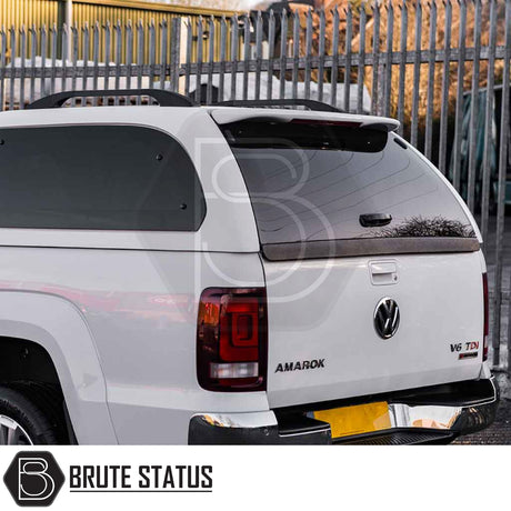 Volkswagen Amarok 2010-2022 Truckman Grand Hardtop Canopy with remote locking, featuring tinted windows, chrome bumper, and VW branding, emphasizing premium style and security.