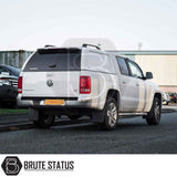 Volkswagen Amarok 2010-2022 Truckman L-Series Hardtop Canopy, featuring a white seamless cab-high design with chrome accents, enhancing security and storage on the pickup truck.