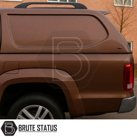 Volkswagen Amarok 2010-2022 Truckman L-Series Hardtop Canopy on metallic brown pickup, featuring Brute Status logo, smooth contoured side, alloy wheel, and secure, windowless design.