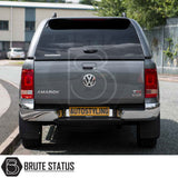 Volkswagen Amarok 2010-2022 with Truckman L-Series Hardtop Canopy, showcasing sleek design and enhanced storage, parked on street with Brute Status watermark.