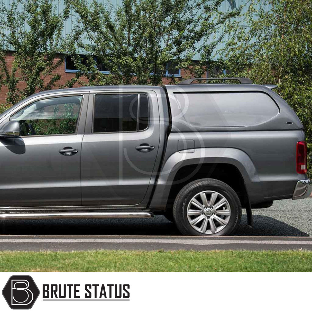 Grey Volkswagen Amarok 2010-2022 fitted with Truckman L-Series Hardtop Canopy, featuring seamless cab-high design, solid sides, and Brute Status branding.
