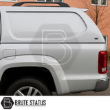 Volkswagen Amarok 2010-2022 Truckman L-Series Hardtop Canopy on a silver pickup, highlighting solid-sided design and rear tail light. Brute Status logo visible.
