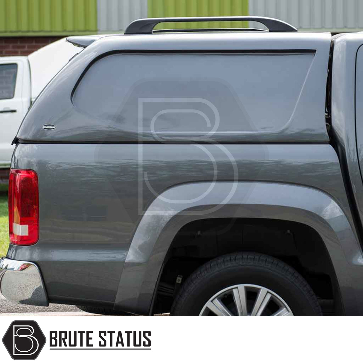 Volkswagen Amarok 2010-2022 Truckman L-Series Hardtop Canopy on dark-gray pickup, featuring cab-high design, solid sides, and smooth fiberglass panel for enhanced cargo security.