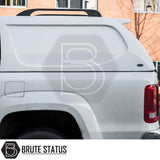 Volkswagen Amarok 2010-2022 Truckman L-Series Hardtop Canopy, rear view; fitted on a white pickup, showcasing solid-sided, cab-high design for enhanced security and storage.