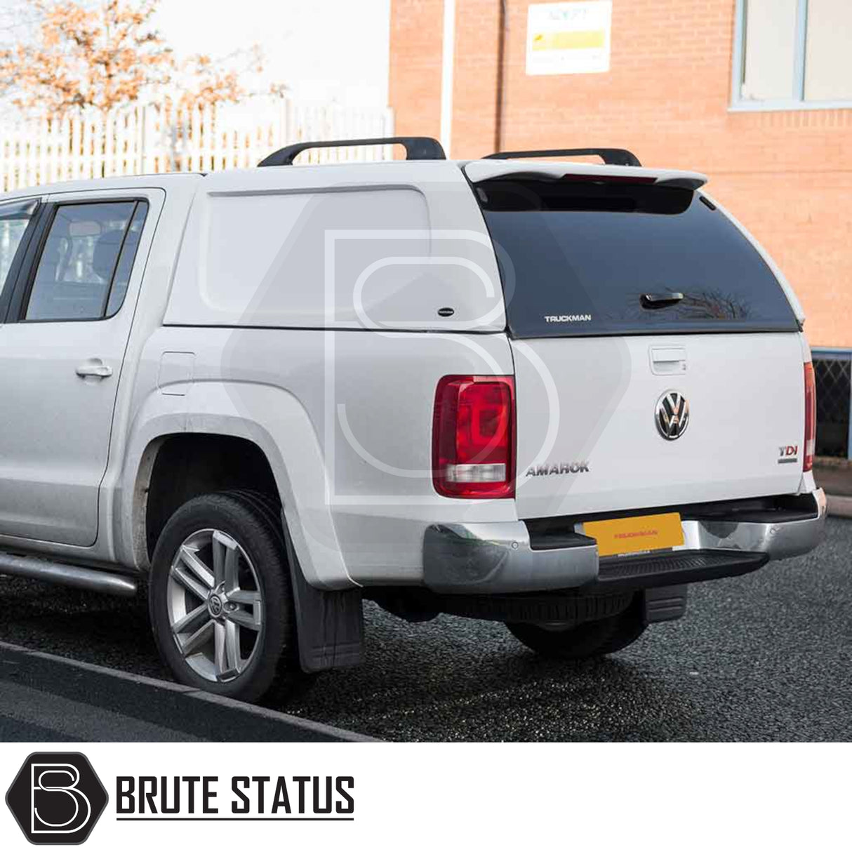 Volkswagen Amarok 2010-2022 Truckman L-Series Hardtop Canopy with color-matched design and roof bars, enhancing security and storage for pickups, shown with Brute Status branding.