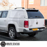 Volkswagen Amarok 2010-2022 Truckman L-Series Hardtop Canopy with color-matched design and roof bars, enhancing security and storage for pickups, shown with Brute Status branding.