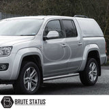 Volkswagen Amarok with Truckman RS Hardtop Canopy, featuring a solid rear window and remote locking, showcasing tubular side-steps and alloy wheels.