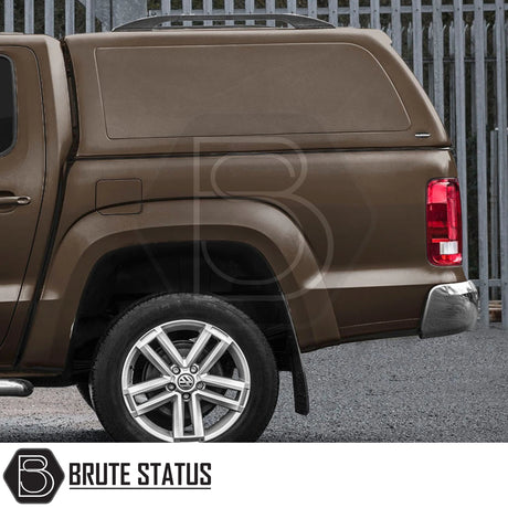 Volkswagen Amarok 2010-2022 Truckman RS Hardtop Canopy with solid rear window and remote locking, showcasing the rear view and alloy rim with VW logo.
