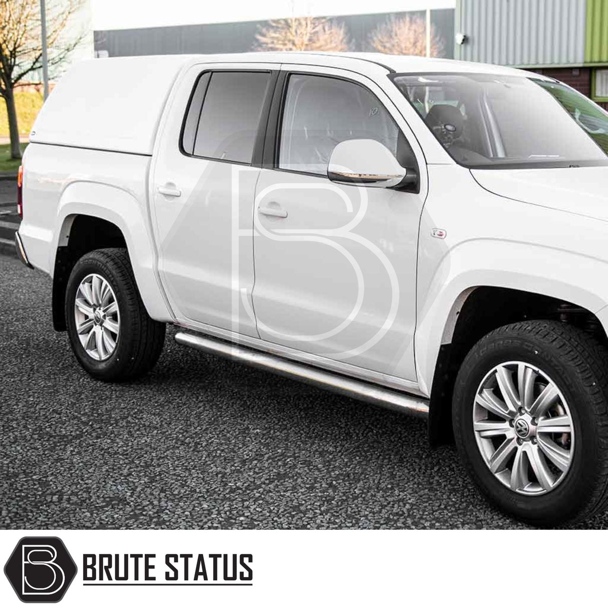 Volkswagen Amarok 2010-2022 Truckman RS Hardtop Canopy with glazed rear window, solid-sided for security, parked on asphalt with chrome side-steps and alloy wheels.