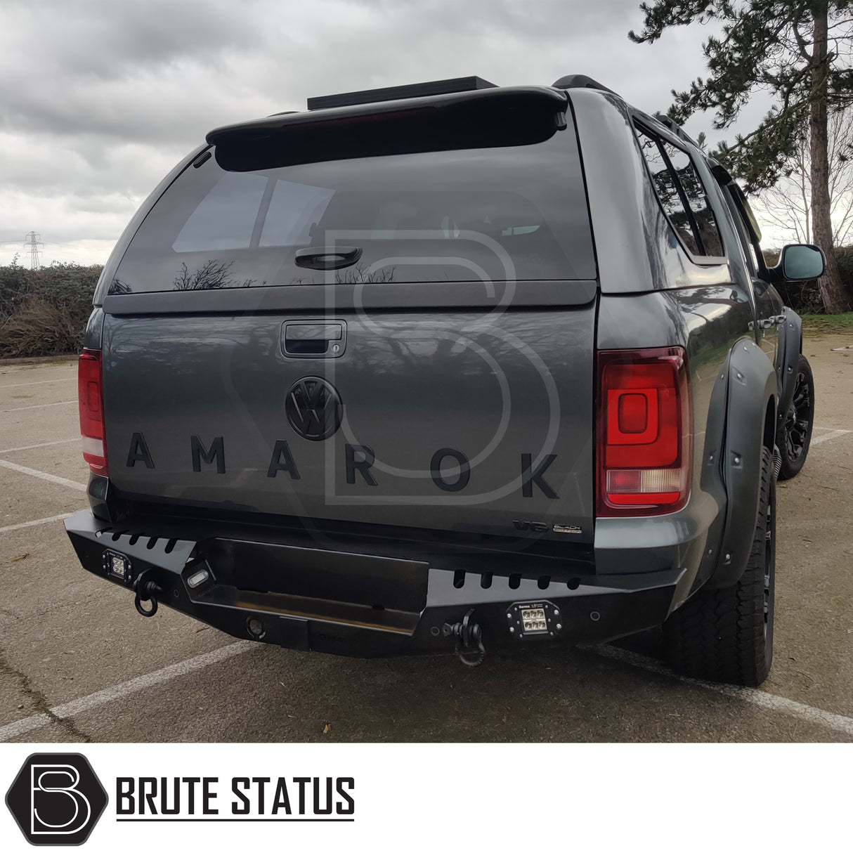 Heavy-duty VW Amarok 2017-2022 rear bumper in powder-coated matte black steel with parking sensor fitment