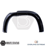 Volkswagen Amarok 2023+ gloss black overfender kit with precision-fit wheel arch flares and rubber seal installation.