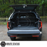 Volkswagen Amarok 2023+ Truckman Grand Hardtop Canopy with open tailgate, featuring a Brute Status storage system and stylish, secure canopy design with remote locking.