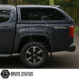 Volkswagen Amarok 2023+ Truckman Grand Hardtop Canopy with tinted windows and 4MOTION badge, showcasing premium rear design and alloy rim.