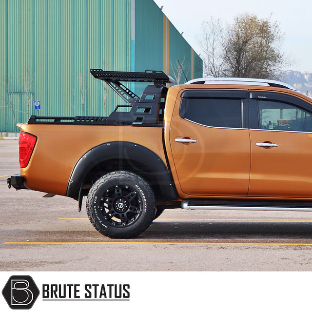 Mercedes X-Class 2017-2020 S10 Combat Roll Bar with Storage Basket on a Nissan Navara, featuring modular steel design and all-terrain BFGoodrich tires.